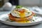 A poached egg bagel with greens on a white plate and on a blurred kitchen background. A healthy and delicious breakfast