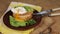 Poached egg for breakfast. Fried bread and avocado. The yolk comes from the protein. Appetizing food. Cutting perfect cut poached