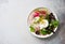 Poached egg and fresh salad of assorted radish and mixed salad leaves