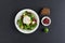 A poached egg served with kidney beans, brussels sprouts and a p