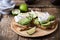 Poached egg and sliced avocado on whole wheat bread toast