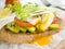 Poached egg,tomato and avocado on whole wheat toast topping with