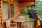 Pocahontas Vacation Cabins, Alberta/Canada - September 2, 2016: Table, chairs, flowers on porch of wooden vacation rental cabin.