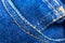 Pocket of blue hipster jeans material. Denim Cloth texture background