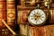 Pocket watch and old books