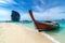 Poda Island Wooden boat parked on the sea, white beach on a clear blue sky, blue sea