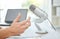 Podcast, microphone and business person hands for career advice, news broadcast and web platform in office. Live