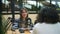 Podcast radio show in studio Asian woman talks into mic Spbd