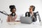 Podcasters, African American and European woman with headphones and microphone