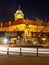 Podebrady by night. Statue of Jiri z Podebrad with castle on background, Czech Republic