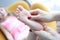 Podiatrist holding child leg in massage parlor closeup