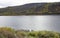 Podkamennaya Tunguska river and motor boats near the shore in autumn