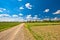 Podravina region green landscape and country road view