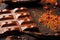 The pods of the carob chocolate bar on a black background