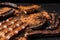 The pods of the carob chocolate bar on a black background