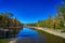 Poetic landscapes, clean blue skies, clear rivers, and lush trees, canyon.