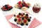 Poffertjes with berries on a cake stand