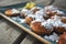 `Poffertjes`, traditional Dutch batter treat resembling small, fluffy pancakes, served with powdered sugar and butter