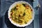 Poha or Kanda Poha popular Maharashtrian breakfast recipe made from red or white flattened rice, potatoes, onions, herbs and spice