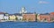 Pohjoisranta embankment, harbor with yacht and ships on background of Finnish Evangelical Lutheran cathedral of Diocese. Helsinki