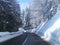 Pohorje, Slovenia, curvy winter road through forest