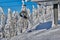 Poiana Brasov, Romania -09 January 2019: Skiers on the ski lift, skiers on slope in Romanian ski resort in sunny day, Poiana