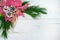 Poinsettia bouquet on whitewashed wood