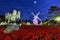 poinsettia, red christmas flower and windmill landmark of The night view is decorated with colorful lights. in Loei, THAILAND.