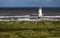 The Point of Ayr Lighthouse, also known as the Talacre Lighthouse, is a grade II listed building situated on the north coast of