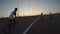 Point of view of cyclist having fun with his biker friends performing various flips and jump tricks outside on biking circuit -