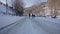 Point of view from drive`s side, vehicle driving on snowy mountain road.