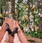 The point of view of a hiker resting in a hammock at a campground with buoys hanging in the trees on the West Coast Trail, B.C.