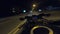 Point of view of motorcycle rider rides in evening town road in high speed. The viewpoint of motorcyclist driving in the