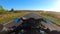 Point of view of a motorcycle rider rides in rural road. The viewpoint of motorcyclist driving motorbike at empty