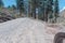 Point of view of motorcycle riding on a dirt road in the arid mountains