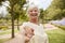 Point Of View Shot Of Senior Couple Walking In Park Together