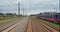 Point of view train travel under cloudy sky