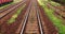 Point of view train travel under cloudy sky