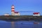 Pointe-des-Monts Lighthouse at dusk with reflections in the sea, Cote-Nord, Quebec