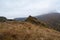 Pointed cliff, a misty mountainside. Ghost rocks. Awesome scenic mountain landscape with big cracked pointed stones closeup in