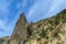 Pointed rock shot against a cloudy sky