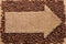 Pointer of burlap with place for your text, lying on a coffee be