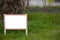 Pointer sign on the lawn with green grass. Banner layout with place for the text dog walking is prohibited , do not walk