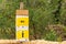 Pointer on a wooden board in a campsite, toilet and shower sign