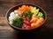 Poke bowl with salmon, tuna, edame beans, green onion, rice and sesame seeds. Raw fish sushi bowl rich with omega 3 and protein.
