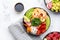 Poke bowl set: tuna, salmon, shrimps with avocado, fruits and vegetables, white rice and other ingredients. Hawaiian cuisine dish