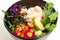 Poke salad with shrimp in a bowl. Ingredients Shrimp, blanched spinach, cherry tomatoes, rice, cucumber, soy-ginger