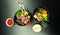 Poke salads with tuna and beef in bowls on the table. Two bowls of poke salad with chopsticks on a gray background