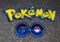 Pokemon GO logo ball drawn on asphalt