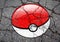 Pokemon GO logo ball drawn on asphalt